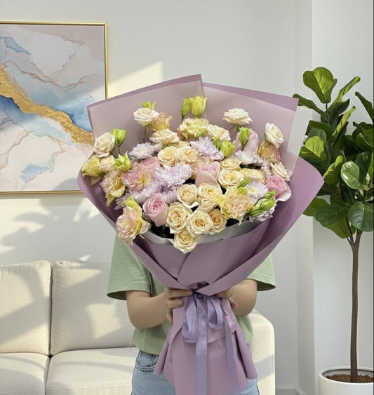 Peach and purple hand bouquet